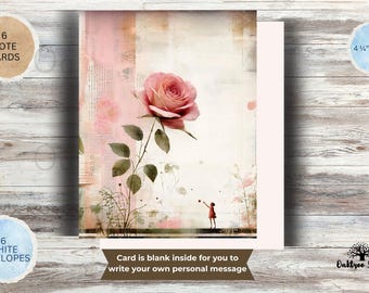 May include: A set of 6 note cards measuring 4.25 inches by 5.5 inches, featuring a pink rose illustration and a small figure reaching toward it. The cards include 6 white envelopes and have a blank interior for personal messages.