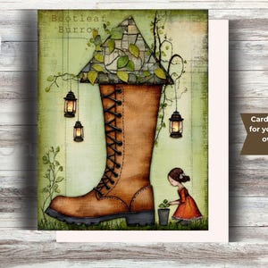 May include: Greeting card featuring an illustration of a brown boot with a house-like structure on top, adorned with hanging lanterns and greenery. A small girl in a red dress is planting a small plant. The card measures 4.25 x 5.5 inches.