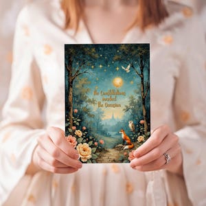 May include: A rectangular greeting card featuring a dark forest scene under a starry night sky with a full moon, a fox, an owl, and flowers. The text "the constellations marked the occasion" is printed in gold lettering in the center of the card.