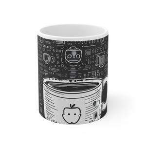 May include: A white ceramic mug featuring a black and white graphic design. The print displays a stylized robot head above a depiction of a mug containing a liquid, with an apple icon on the front and various digital code-like symbols surrounding it.
