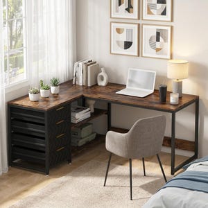 May include: An L-shaped desk with a dark wood grain surface and a black metal frame. It features four black drawers with gold handles, open shelving for storage, and a gray upholstered chair with black metal legs positioned in front.
