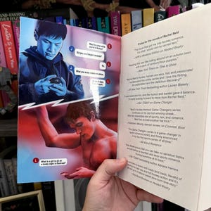 May include: A book with an open cover featuring a split-screen illustration of two people using phones. The top panel shows a person in blue tones, and the bottom shows a person in red tones. The right page contains printed praise for Rachel Reid.