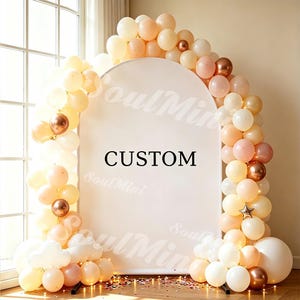 May include: An arched backdrop display featuring the word CUSTOM in black text, surrounded by a dense balloon garland in shades of cream, peach, and metallic copper. The display includes a small star-shaped balloon and scattered floor confetti.
