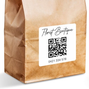 May include: A brown paper bag with a white label that says "Florist Boutique" and has a black and white QR code and the phone number 0421 334 578.