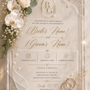May include: A rectangular clear acrylic wedding invitation featuring gold-toned filigree corners, a central gold monogram, and printed text including Bride's Name and Groom's Name. It is decorated with white roses, orchids, baby's breath, eucalyptus, and two gold rings.