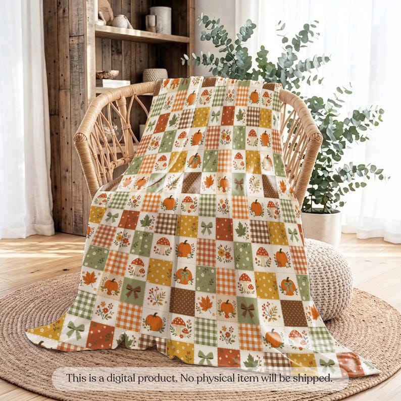May include: A throw blanket featuring a patchwork grid pattern with alternating squares of orange, green, and brown. The design includes illustrations of pumpkins, mushrooms, autumn leaves, small flowers, and bows. Text at the bottom reads: This is a digital product. No physical item will be shipped.