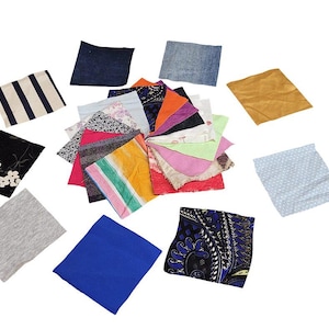 May include: A collection of assorted square fabric swatches featuring various colors, textures, and patterns including floral, striped, paisley, and solid designs arranged in a circular cluster with several individual pieces placed around the center.