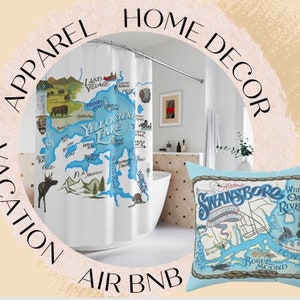 May include: A blue and white shower curtain featuring a map of Yellowstone Lake and a blue and white throw pillow with a map of Swansboro, North Carolina. The text on the pillow reads "Swansboro, North Carolina".