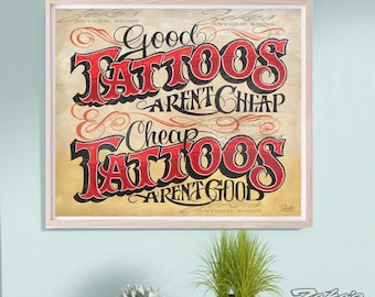 May include: A square framed wall sign featuring the text Good TATTOOS AREN'T CHEAP and Cheap TATTOOS AREN'T GOOD in a stylized black and red font. The background has a weathered, light brown wood grain texture with faint decorative flourishes.