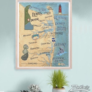 May include: A framed map print of Delaware featuring coastal towns like Lewes, Rehoboth, and Bethany. The map includes illustrations of a lighthouse, a blue crab, a stack of oysters, and a dolphin, with text labels for geographic locations.