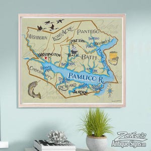 May include: A framed map print featuring the Pamlico River region with blue waterways and tan landmasses. The map displays locations including Washington, Bath, and Aurora, with illustrations of a fish, birds, and a boat. The text includes place names and the Pamlico R. label.