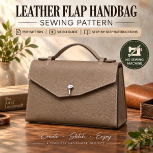 May include: A taupe leather flap handbag with a top handle and a silver-tone metal turn-lock closure. The bag features a textured surface, visible white stitching along the edges, and a structured rectangular shape. Text includes LEATHER FLAP HANDBAG SEWING PATTERN, PDF PATTERN, VIDEO GUIDE, STEP-BY-STEP INSTRUCTIONS, NO SEWING MACHINE, and Create Stitch Enjoy A TIMELESS HANDMADE PROJECT.