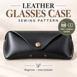 May include: A black leather glasses case sewing pattern featuring a triangular flap with a brass-colored snap button, white contrast stitching along the edges, and two small rivets. The text reads LEATHER GLASSES CASE SEWING PATTERN PDF + VIDEO GUIDE.