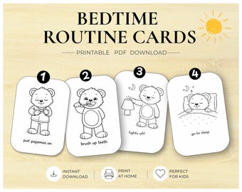 May include: Four white rectangular cards with rounded corners featuring black line art of a bear performing bedtime tasks. The cards are numbered one through four with text labels: put pajamas on, brush up teeth, lights off, and go to sleep.