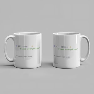 May include: Two white ceramic mugs featuring printed computer code text that reads $ git commit -m "Fixed everything" followed by # famous last words. The text uses a combination of black, yellow, and green colours to mimic a terminal interface.