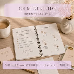 May include: A spiral-bound notebook titled CE MINI-GUIDE with German text outlining steps for CE compliance. The pages feature a numbered process flow, checkmarks, and heart icons. Surrounding items include a ceramic mug and sticky notes.
