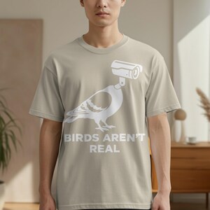T-shirt with pigeon graphic and text "BIRDS AREN'T REAL".