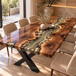 May include: A rectangular dining table featuring a live-edge wood slab with a central river design made of translucent resin, embedded river stones, and a glossy finish. The table is supported by a black metal X-shaped base and includes chairs.