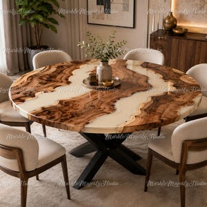 May include: A round dining table featuring a natural wood slab with a prominent live edge and a central white resin river inlay, supported by a black metal X-shaped base, surrounded by six upholstered chairs with curved wooden backrests.