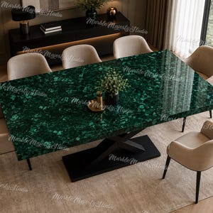 May include: A rectangular dining table with a polished green malachite patterned surface and a black metal X-shaped base. The table is surrounded by six beige upholstered armchairs with black legs, creating a complete dining set arrangement.
