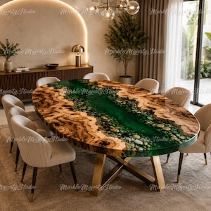 May include: An oval dining table featuring a natural wood slab edge and a central river design made of translucent green resin embedded with smooth river stones, supported by a gold-toned metal base with intersecting legs.