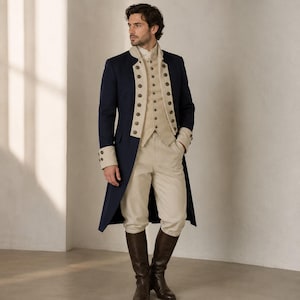 May include: A navy blue long coat with a high collar and light beige cuffs, worn over a matching light beige button-up vest and light beige trousers. The ensemble features rows of round buttons on the coat front, cuffs, and vest, paired with dark brown knee-high boots.