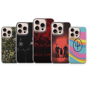 May include: Five smartphone cases featuring various designs: one with a floral pattern and yellow logo, one with two figures in black, one with red text reading SO PROUD SO EMOTIONAL HELLO CLAN, one with two figures on a red background, and one with a colourful wave pattern.