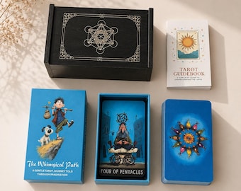May include: A tarot card deck set including a black wooden box with a gold geometric design, a white guidebook with a sun illustration, and blue-toned cards. One card shows a character with a dog, titled The Whimsical Path, and another shows a figure sitting on a stone structure, labeled Four of Pentacles.