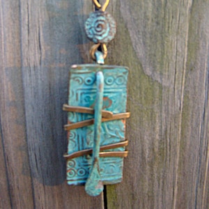 Cantilevered Verdigris Stamped and Wrapped Rectangle with Paddle Bead