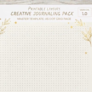 Könnte beinhalten: Eine druckbare A5-Punktgitterseite aus einem kreativen Journaling-Paket, Version 1.0. Das cremefarbene Papier zeigt goldfarbene botanische Blattillustrationen in den oberen Ecken und kleine goldene Sterne, die über das Gitter verteilt sind.