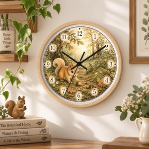 May include: A round wall clock with a light wood frame featuring a printed illustration of a squirrel in a forest setting. The clock face displays black numerals from 1 to 12, black hour and minute hands, and a thin black second hand over the scene.