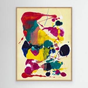 Op de afbeelding: Een ingelijst abstract schilderij op een lichtgele achtergrond met levendige spetters en gedurfde streken van rode, magenta, diepblauwe, groenblauwe en felgele verf. De compositie bestaat uit gelaagde organische vormen en lijnen.