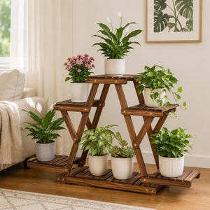 May include: A multi-tiered wooden plant stand with a dark brown finish, featuring six distinct levels for displaying potted plants. The structure has an A-frame design with slatted shelves, providing space for various indoor plants in white and grey pots.