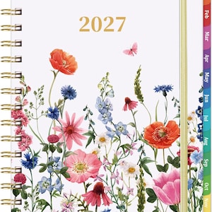 May include: A 2027 spiral-bound planner with a white cover featuring a colorful watercolor illustration of wildflowers and a small butterfly. The planner includes gold-tone wire binding, a gold elastic closure, and monthly tabs labeled Jan through Dec.