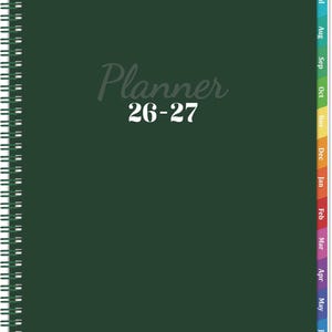 May include: A dark green spiral-bound planner with the text Planner 26-27 printed in white and light gray on the front cover. The planner features a vertical row of colorful monthly tabs along the right edge, labeled from July to June.