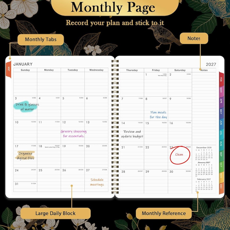 May include: A 2027 monthly planner open to January, featuring a spiral-bound design with white pages, black grid lines, and colourful monthly tabs. The layout includes large daily blocks, a notes section, and a monthly reference calendar for 2027.