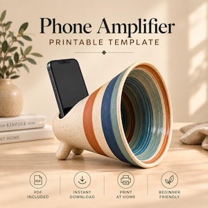 May include: A cone-shaped phone amplifier printable template featuring a speckled cream base with horizontal stripes in terracotta, navy blue, and teal. The text Phone Amplifier Printable Template is displayed above, with icons for PDF, download, print, and leaf.