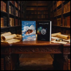 May include: Two hardcover books titled Book of Wisdom. The left book features a blue sky with clouds and a human eye peering through. The right book has a black cover with a silver pentagram symbol against a colorful nebula background.