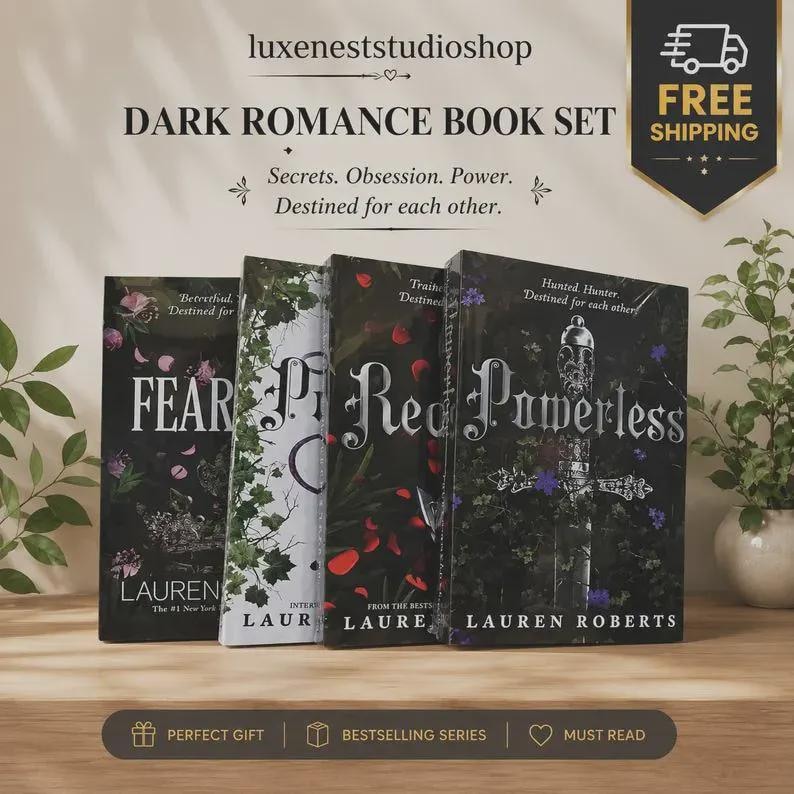 May include: A set of four books titled Dark Romance Book Set by Lauren Roberts, including Fear, Powerless, and others. The covers feature dark, botanical, and sword illustrations with white text. The set is displayed on a wooden surface.