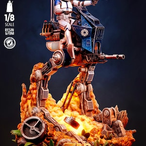May include: A 1/8 scale resin and FDM model of a white and blue scout trooper riding a bipedal walker vehicle. The walker stands on a base featuring orange flames, debris, and green foliage. Text includes TESTED PRESUPPORTED, 1/8 SCALE, and STAR WARS.