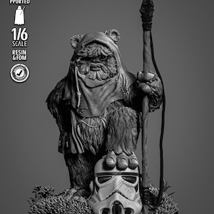 May include: A 1/6 scale resin and FDM 3D printed figurine of a furry creature wearing a hooded cloak, holding a tall spear, and standing with one foot resting on a damaged stormtrooper helmet. The base features textured ground foliage.