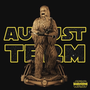 May include: A tan-colored, textured figurine of a tall, fur-covered creature holding a bowcaster weapon. The figure stands on a circular base with mechanical details. Behind the figure, the text AUGUST TERM is displayed in large, yellow-outlined letters with a starry pattern inside. A small logo in the bottom right corner reads STAR 3D MODELS WARS.