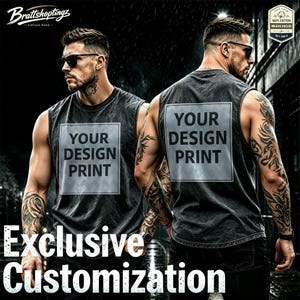 May include: A charcoal gray sleeveless shirt with a vintage wash finish, featuring a square graphic area on the chest and back with the text YOUR DESIGN PRINT. The shirt includes a small label in the corner stating 100% COTTON WASH HELD.