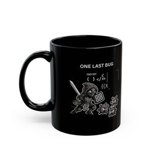 May include: A black ceramic mug featuring a graphic of a hooded warrior holding a sword and shield, battling small round creatures. The text "ONE LAST BUG" is printed above the warrior, accompanied by binary code and programming symbols.