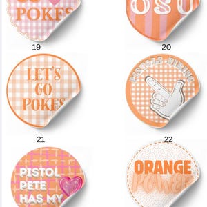 May include: Six circular stickers with orange and white patterns. Sticker 19 says GO POKES with a heart. 20 says OSU. 21 says LET'S GO POKES. 22 shows a hand gesture with PISTOLS FIRING. 23 says PISTOL PETE HAS MY HEART. 24 says ORANGE POWER.