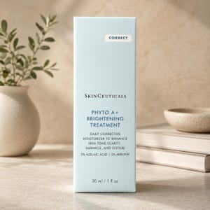 May include: A light blue rectangular skincare product box labeled SkinCeuticals Phyto A+ Brightening Treatment. The text includes Daily Corrective Moisturizer to enhance skin tone clarity, radiance, and texture, 3% Azelaic Acid, 2% Arbutin, and 30 ml / 1 fl oz.