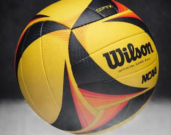 Balón oficial de voleibol de playa Wilson AVP OPTX para partidos del Tour, color negro y amarillo.