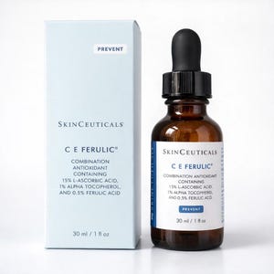 May include: A light blue rectangular box and a brown glass dropper bottle of SkinCeuticals C E Ferulic combination antioxidant treatment. The packaging displays the text 15% L-Ascorbic Acid, 1% Alpha Tocopherol, and 0.5% Ferulic Acid with 30 ml / 1 fl oz.