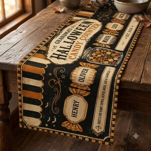 May include: A black, orange, and cream table runner featuring the text Grandma's Halloween Candy Counter, a jar of candy, and candy-shaped labels with the names Jack, Leo, Maya, Oliver, and Henry, along with the text Est. 2026 and Sweets for Henry, Sophia, Maya, Leo & Isabelle.