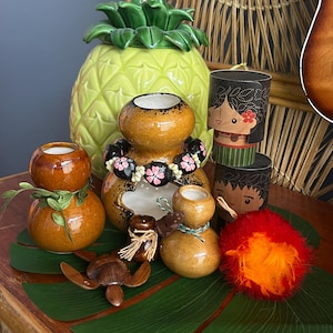 Discovered in Hawaii -Eight fun Hawaiian decor items - 4 ceramic Ipu, miniature uli uli, Hawaiian couple  and a wood Hawaiian honu. So fun!